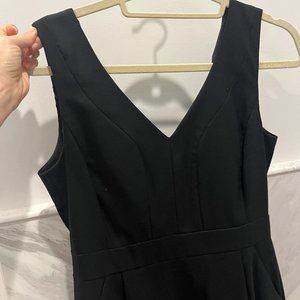 Sleeveless black suit dress